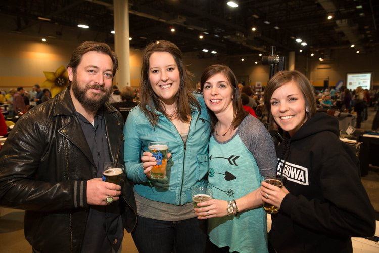 Jason Walsmith (from left), Emma Peterson, both of Des Moines, Jess Olsen of Madrid, and Angie Amsted of Granger, Saturday, Jan. 24, 2015, during the Ragbrai Route Announcement Party at the Iowa Events Center in Des Moines.