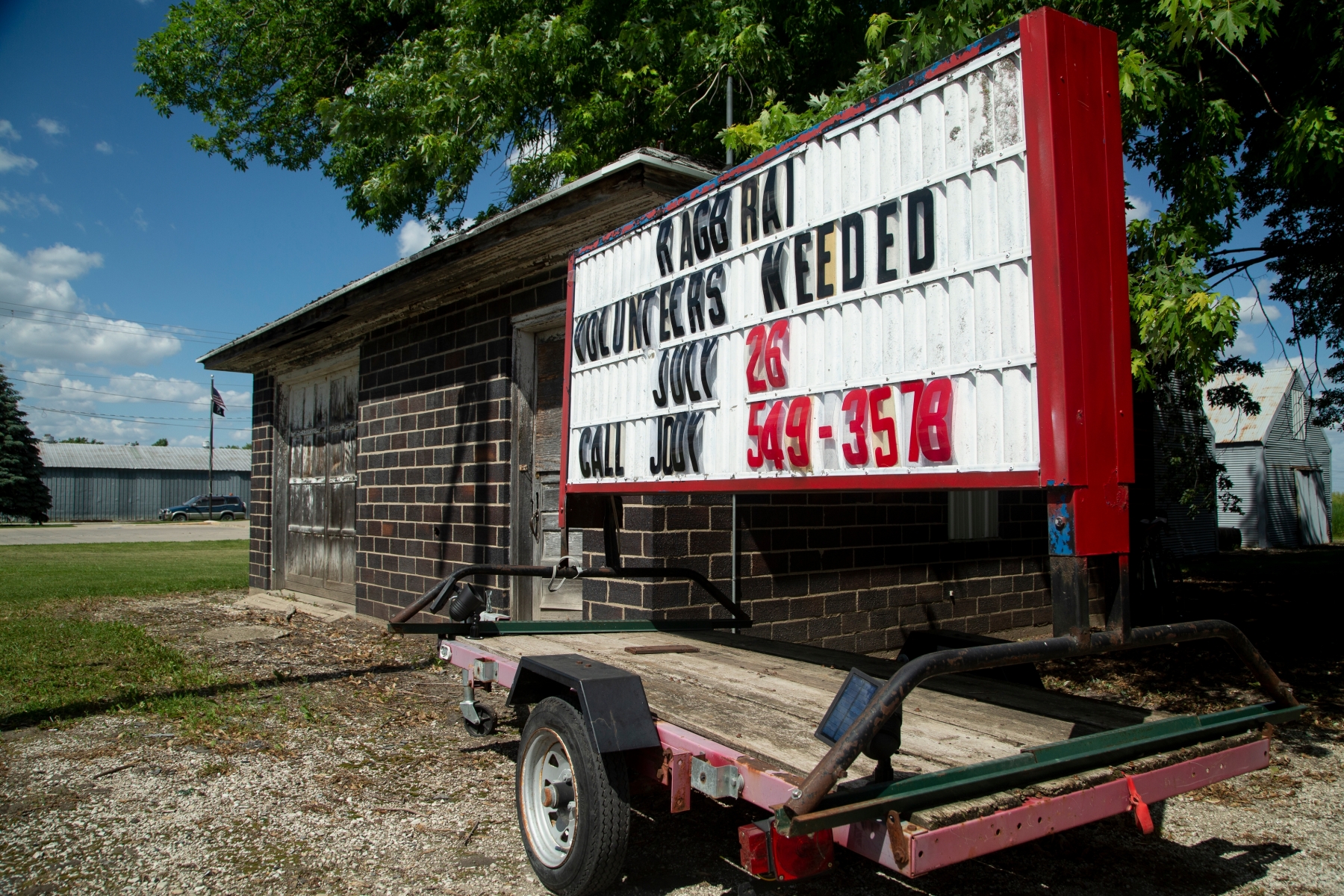 A sign asking for volunteers in Moorland is seen during the RAGBRAI route inspection ride on Monday, June 7, 2021. Volunteers are still needed in towns across the state.