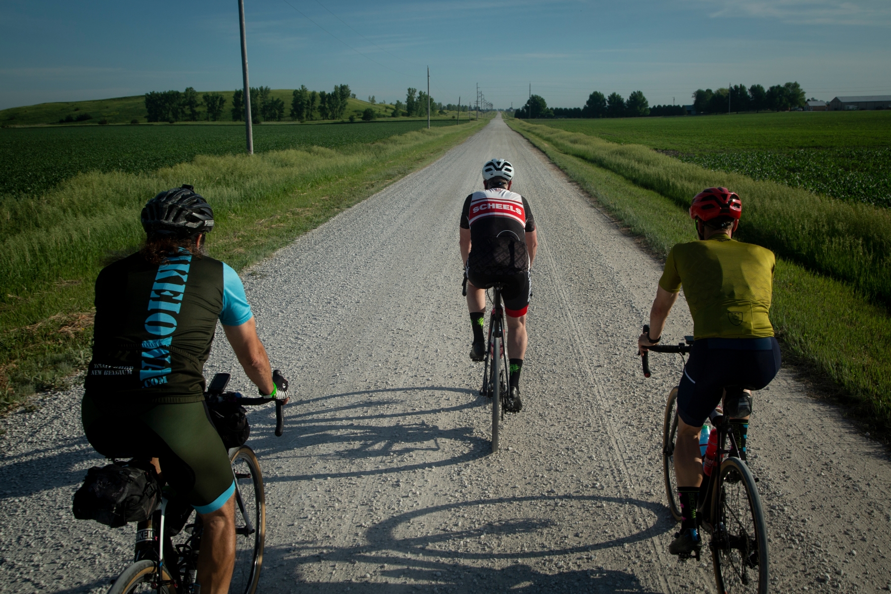 Scott Olsen, right, and Scott Sumpter, left, and Matt Phippen, center, start on the optional gravel route from Fort Dodge to Webster City during the RAGBRAI route inspection ride on Tuesday, June 8, 2021.