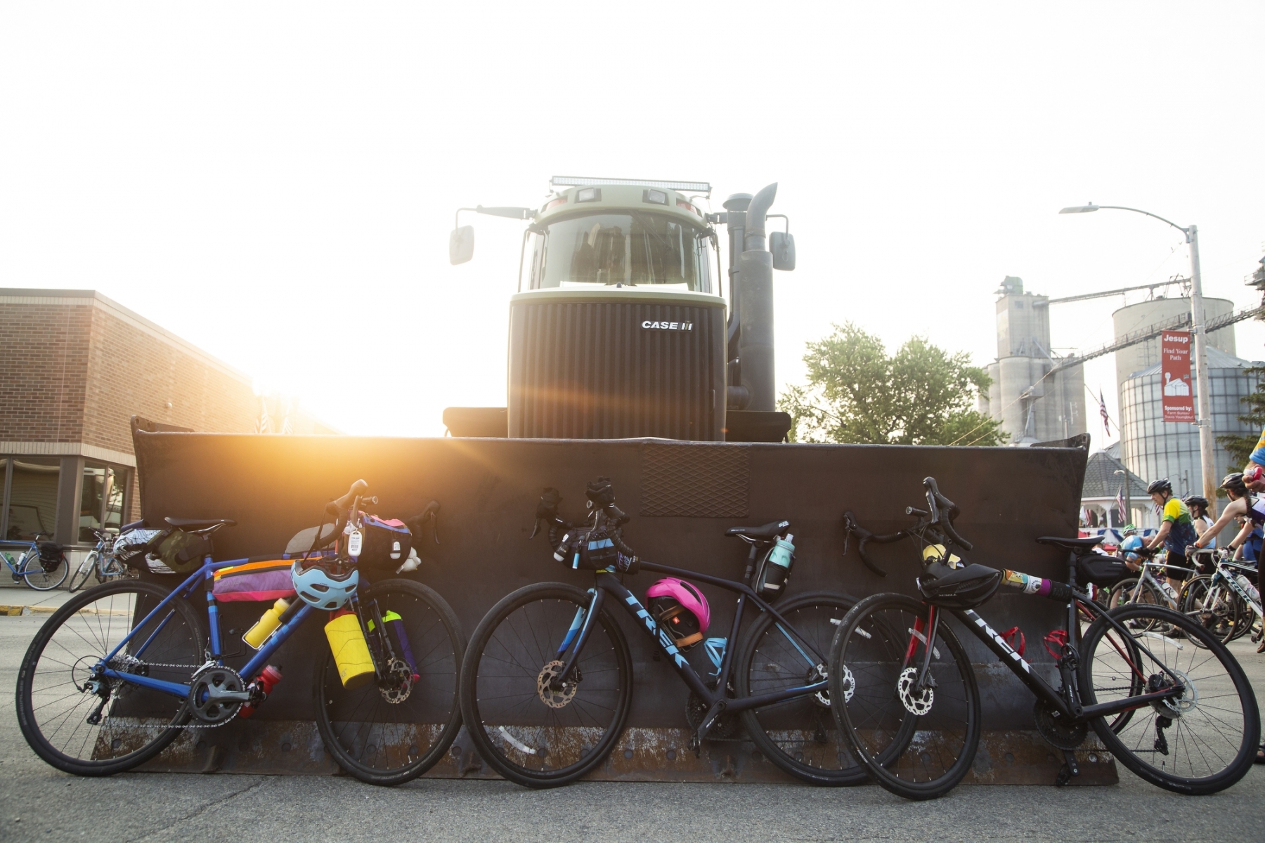 A tractor is used as a bike rack as RAGBRAI riders get breakfast in Jesup on Thursday, July 29, 2021.
