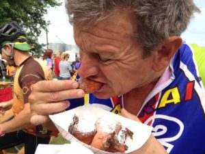Dennis Jennings of Libertyville, Ill., samples fried Jell-O on the road to Hedrick. (Michael Morain/The Register)