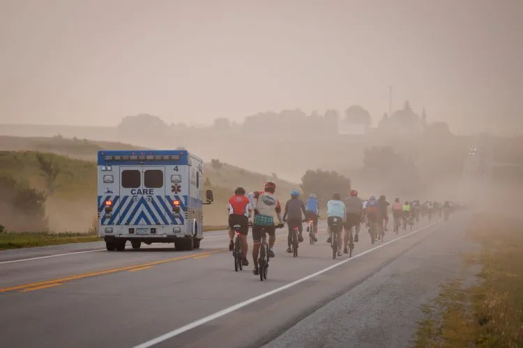 Care Ambulance driving besides bikers Care Ambulance driving besides bikers